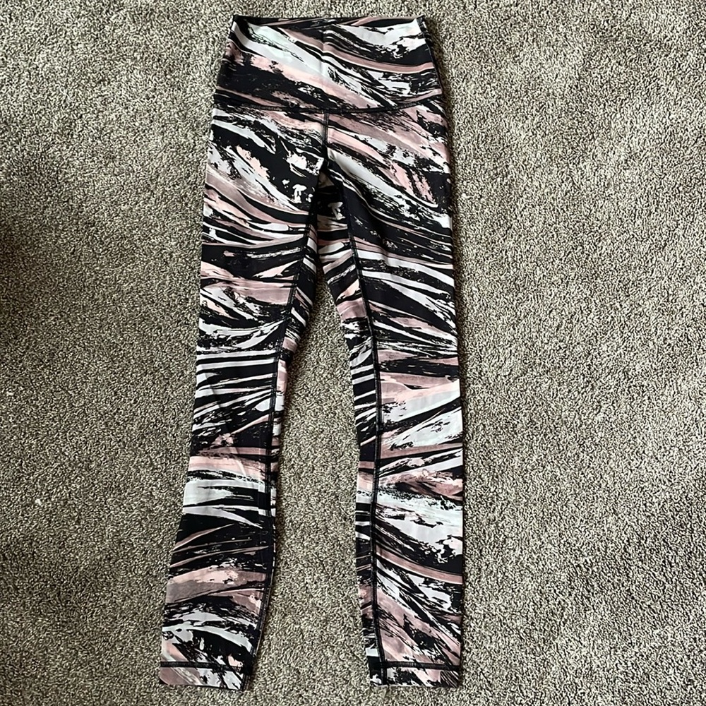 Lululemon black and pink leggings. Size 2. Worn. Good condition.